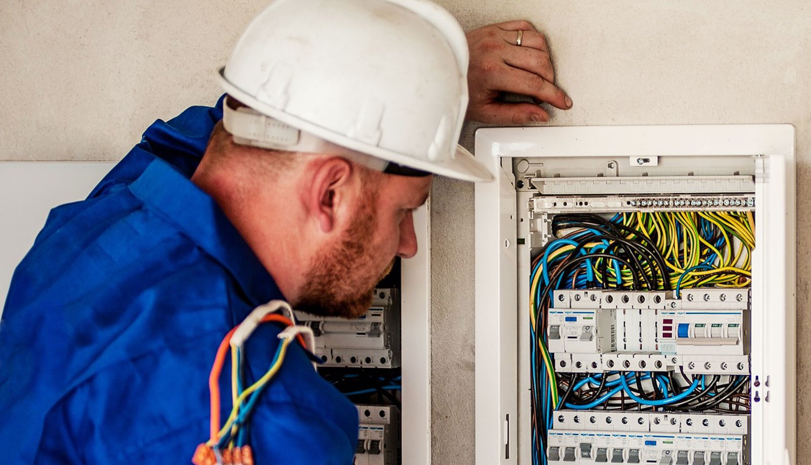 Man looking at an electrical panel